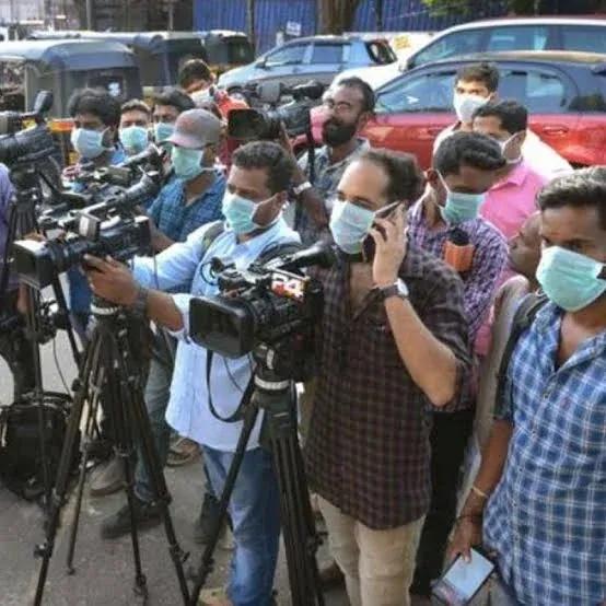 Cameras at a media briefing