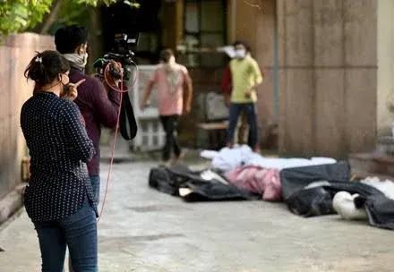A crew filming an on-location story